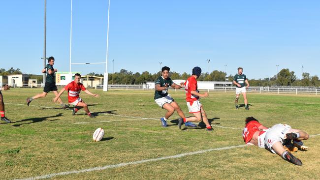 Spectators cheer on as they watch the B Grade St George vs Condamine match at the Roma Rugby Races at Bassett Park. Picture: Chloe Cufflin.