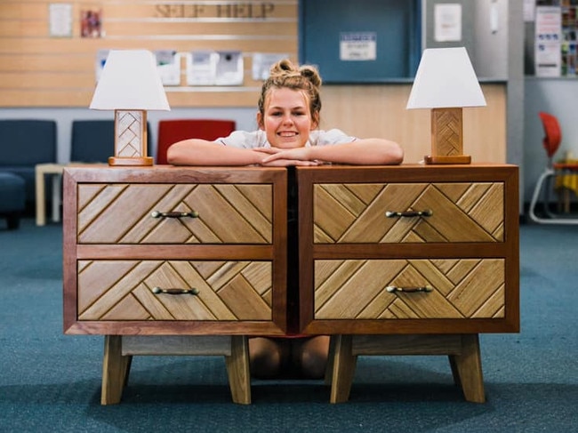 Proving a talent with her hands both in and out of the commercial kitchen, Taylah Anderson poses with her Year 12 Timber major project in 2019.