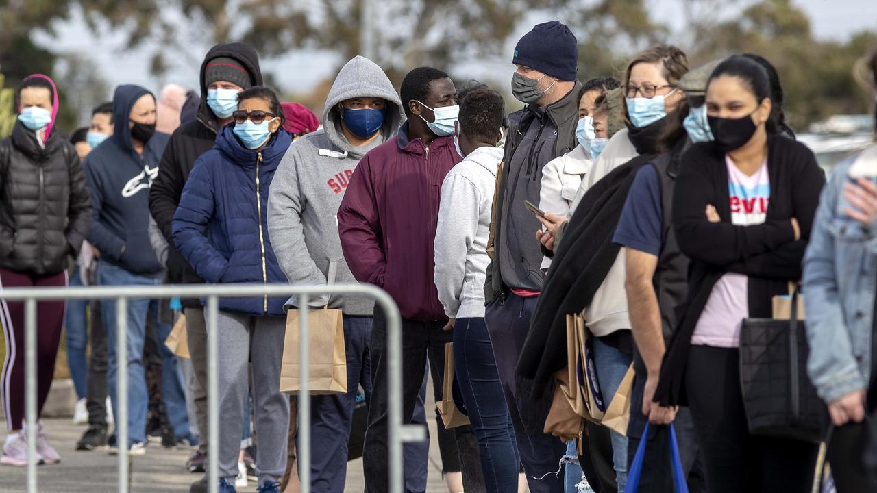 People queue for Covid vaccination at Victoria’s Sandown Racecourse. Picture: NCA NewsWire/David Geraghty