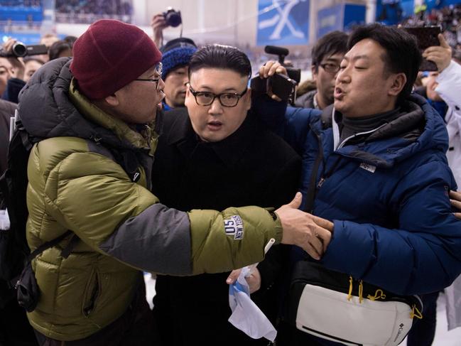 A Kim Jong Un impersonator is forced out in the final period of the women’s preliminary round ice hockey match between Japan and the Unified Korean team during the Pyeongchang 2018 Winter Olympic Games at the Kwandong Hockey Centre in Gangneung on February 14, 2018. Picture: AFP