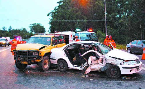 The SES had to cut a woman free after this two-car smash at the intersection of the Pacific Highway and Moonee Beach Road.