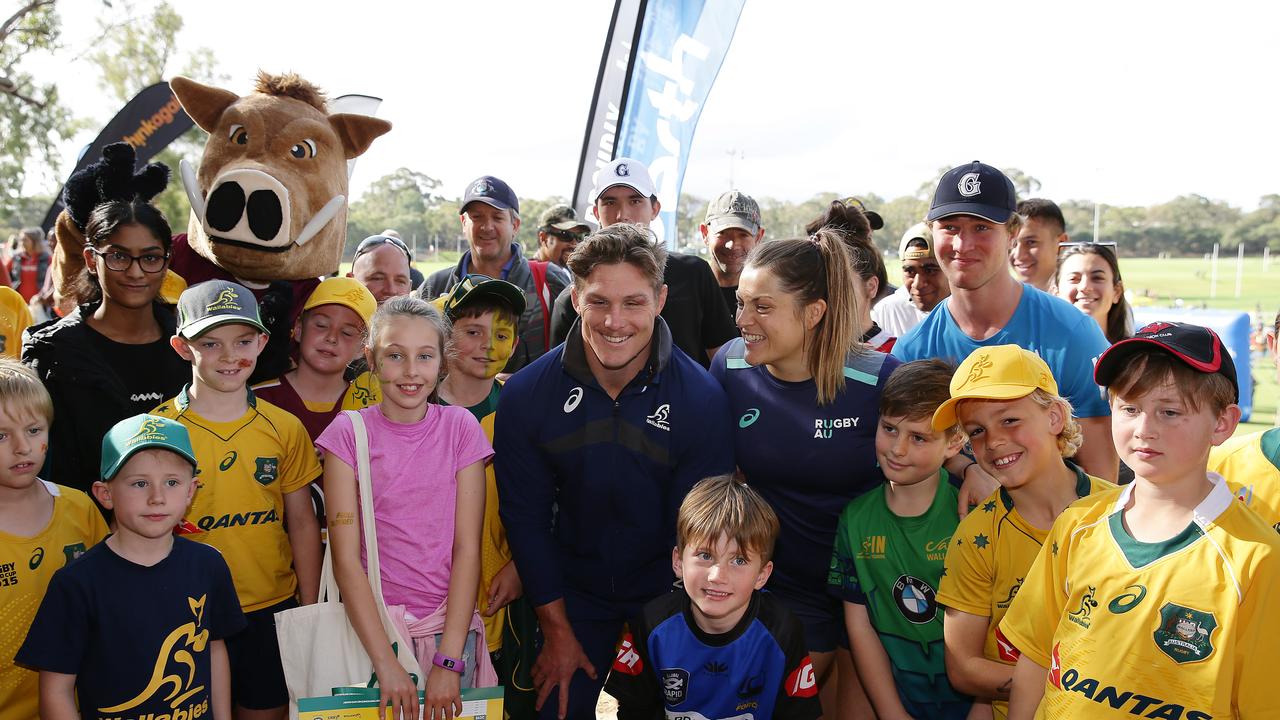 Michael Hooper of the Wallabies and Grace Hamilton of the Wallaroos with fans.