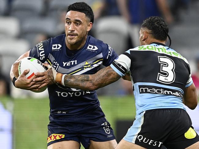 TOWNSVILLE, AUSTRALIA - JULY 27: Valentine Holmes of the Cowboys is tackled by Jesse Ramien of the Sharks during the round 21 NRL match between North Queensland Cowboys and Cronulla Sharks at Qld Country Bank Stadium, on July 27, 2024, in Townsville, Australia. (Photo by Ian Hitchcock/Getty Images)