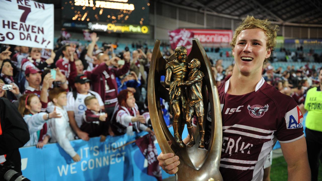 DCE with the 2011 premiership trophy. Picture: AAP/Dean Lewins