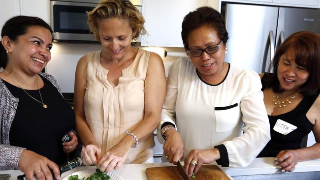 NEW YORK - FOR FEATURES NEWS: "Housekeeper Bootcamp" organized by Jill Wilpon, founder of Chorz, Harlem, NY, Sunday, June 14, 2015. PICTURED: Housekeepers learn simple and healthy recipes during a cooking demonstration with Chef Dorothy Fine. (l. to r.): Maria Campbell, 42; Ursula Cardenas, 51; Mailen Gaudite, 55; and Lottie Belmonte, 62. (Angel Chevrestt, 646.314.3206)