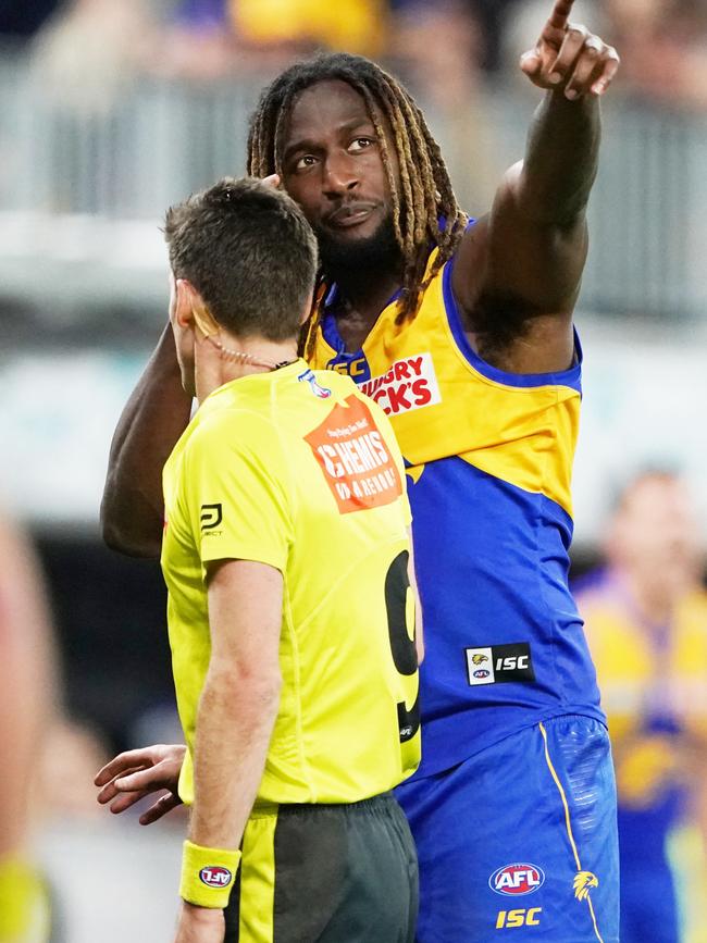 Nic Naitanui complains to the umpire after a melee during the Eagles’ win over Essendon. Picture: AAP Image/Michael Dodge.