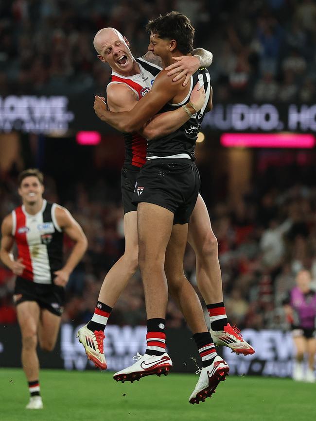 Zak Jones celebrates Isaac Keeler’s first goal in the AFL. Picture: Robert Cianflone/Getty Images