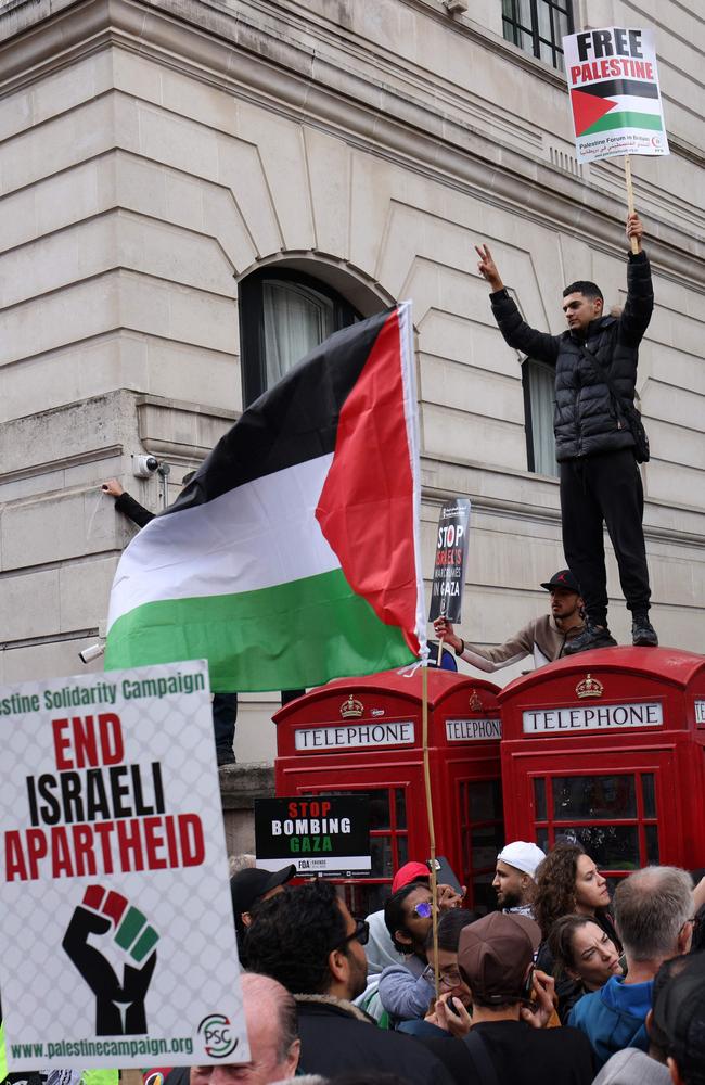 People gather with placards and Palestinian flags to take part in a 'March For Palestine', part of a pro-Palestinian national demonstration, in London. Picture: AFP