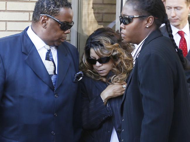 Prince’s sister, Tyka Nelson, centre, leaves the Carver County Courthouse.
