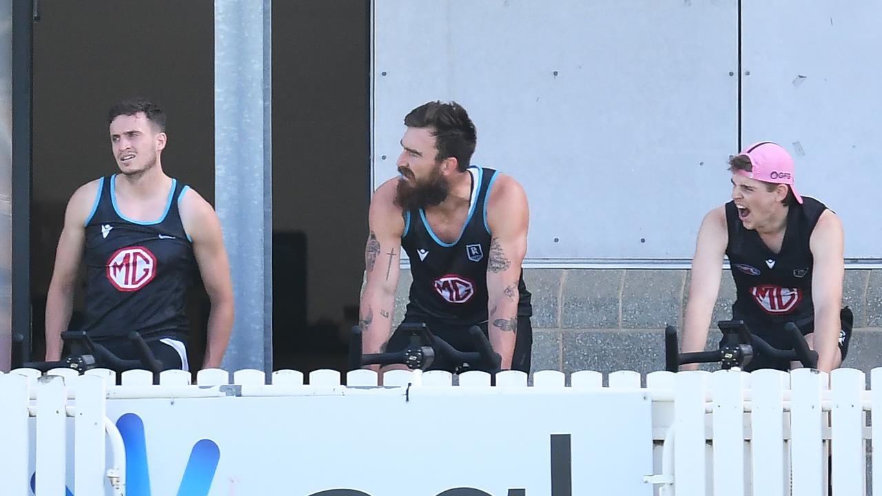 Orazio Fantasia, Charlie Dixon and Hugh Jackson on the sidelines at Port Adelaide training. Picture: Mark Brake