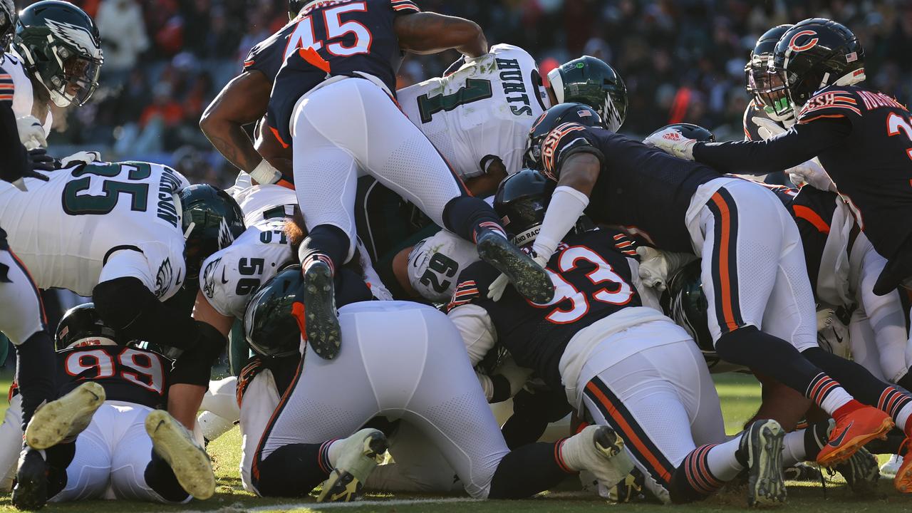 CHICAGO, ILLINOIS - DECEMBER 18: Jalen Hurts #1 of the Philadelphia Eagles dives for a touchdown during the third quarter in the game against the Chicago Bears at Soldier Field on December 18, 2022 in Chicago, Illinois. (Photo by Michael Reaves/Getty Images)