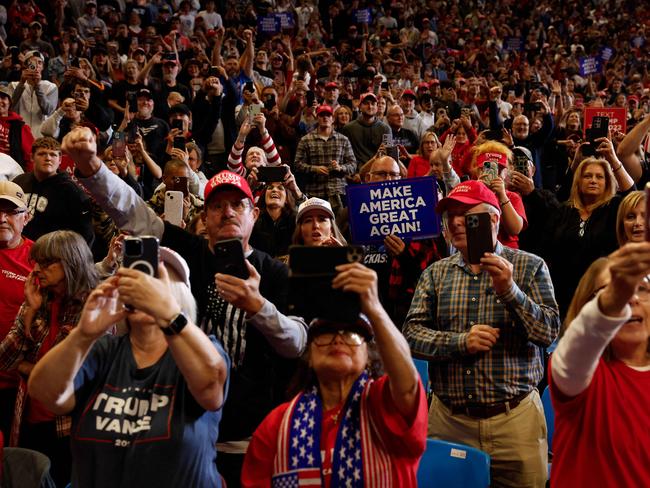 STATE COLLEGE, PENNSYLVANIA - OCTOBER 26: Supporters listen to Republican presidential nominee, former U.S. President Donald Trump speak during a campaign rally at Bryce Jordan Center on October 26, 2024 in State College, Pennsylvania. Trump is scheduled to hold rallies in Michigan and Pennsylvania on Saturday before closing out the weekend with a rally on Sunday at New Yorkâs Madison Square Garden. on October 26, 2024 in State College, PA.   Anna Moneymaker/Getty Images/AFP (Photo by Anna Moneymaker / GETTY IMAGES NORTH AMERICA / Getty Images via AFP)