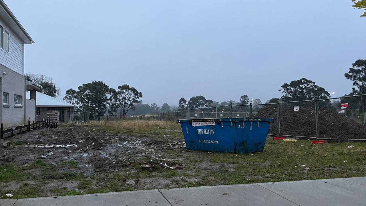 What their property looks like after a year and four months since signing the contract. The skip bin is not theirs and has been dumped there.