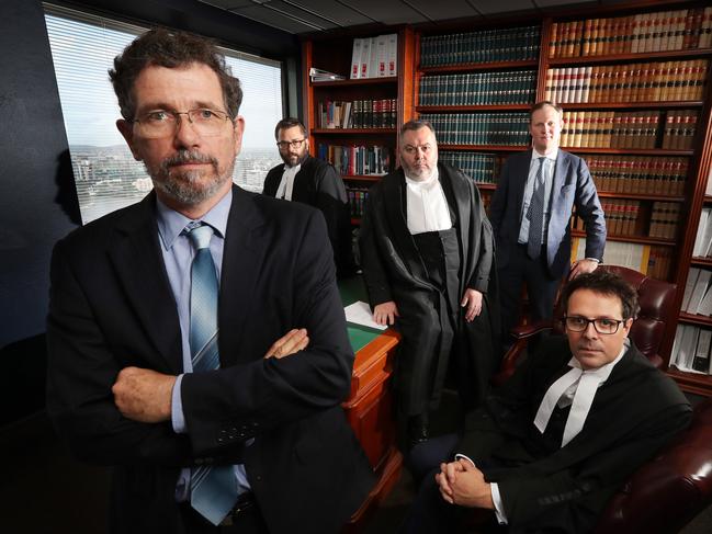 Former JCU climate scientist Peter Ridd preparing with his legal team barrister Benjamin Kidston, QC Stuart Wood, lawyer Mitchell Downes, barrister Benjamin Jellis, on last day of a Federal Court hearing, John Jarrard Chambers, Brisbane. Mr Ridd claims he was unfairly dismissed from his job with the university for publicly voicing his opinions on climate change and coral bleaching which contradicted his colleaguesÕ research. Photographer: Liam Kidston. NO BYLINE.