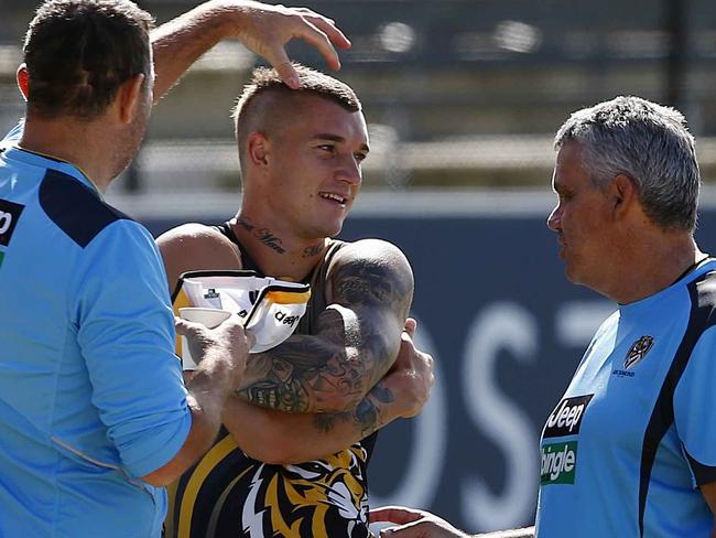 Brendon Lade and Mark Williams admiring Dustin’s new do. Picture: Wayne Ludbey