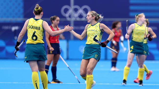 PARIS, FRANCE - AUGUST 03: Alice Arnott of Team Australia (R) celebrates scoring her team's first goal with teammate Penny Squibb during the Women's Pool B match between Australia and Spain on day eight of the Olympic Games Paris 2024 at Stade Yves Du Manoir on August 03, 2024 in Paris, France. (Photo by Lintao Zhang/Getty Images)