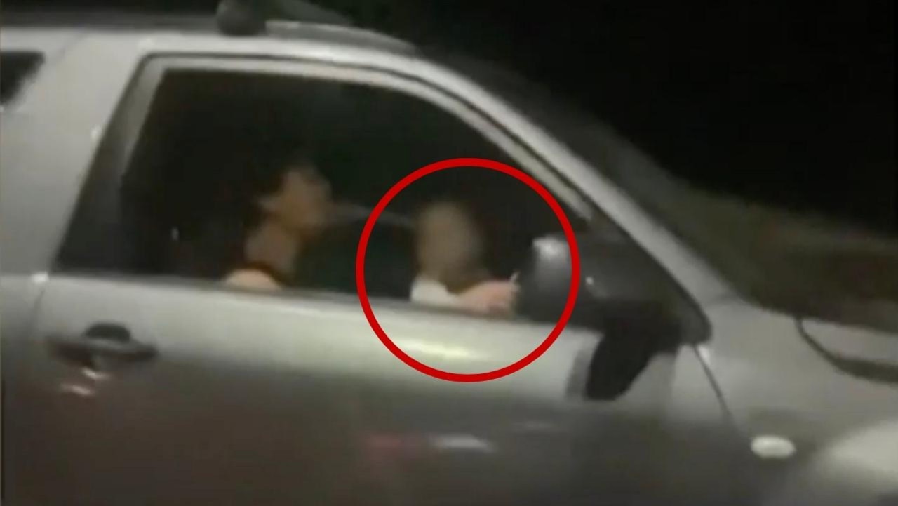 A man has been filmed driving with what appears to be a baby on his lap. Picture: Channel 9.