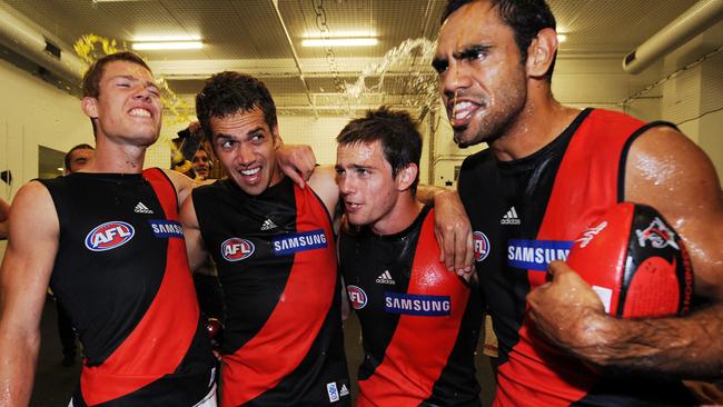 Melksham enjoying his firts win at Essendon with Mark Williams, Travis Colyer and Nathan Lovett-Murray.