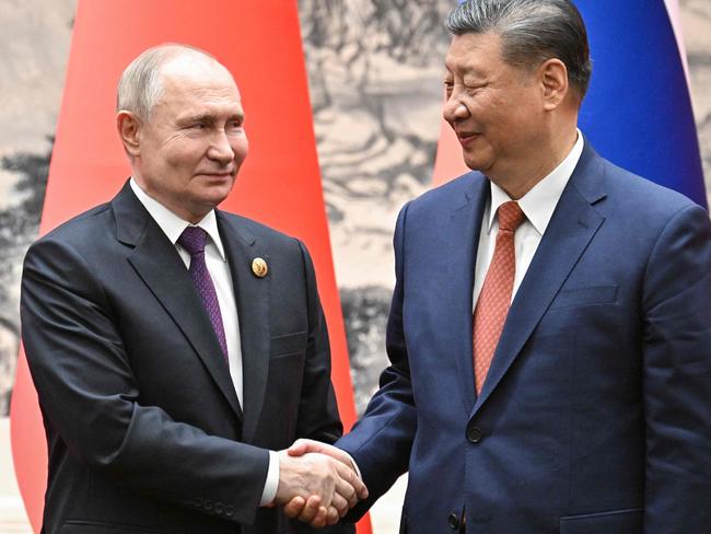 Russia’s President Vladimir Putin and China's President Xi Jinping shake hands following their talks in Beijing on May 16, 2024. Picture: Sergei Bobylyov / AFP