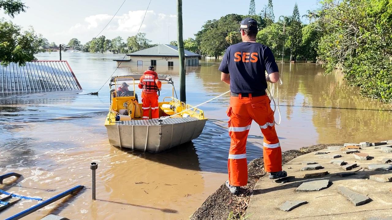 Floody Legends: SES crews working in floodwaters at the Wide Bay. Please attribute to QFES.