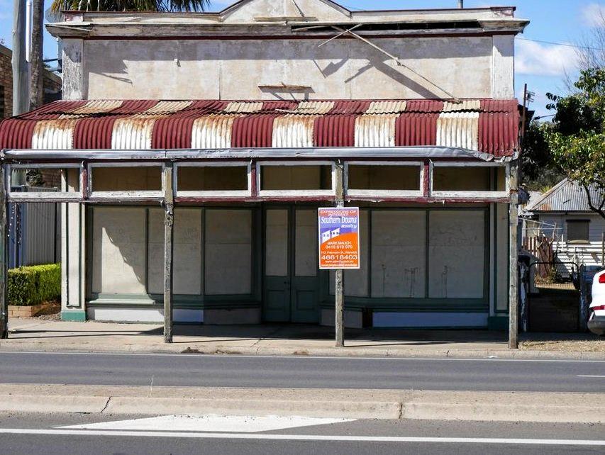 Knock these old buildings down and you've got a prime location for a commercial enterprise. Picture: realcommercial.com.au