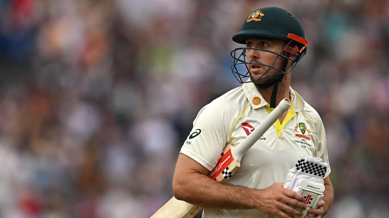 Australia's Mitchell Marsh walks off the ground after losing his wicket. Picture: AFP