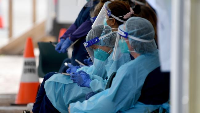 NSW Health workers in PPE waiting for patients at the St Vincent's Hospital drive through COVID-19 testing clinic at Bondi Beach today. Picture: NCA NewsWire/Bianca De Marchi