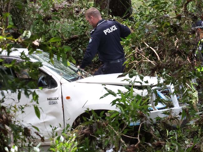 Police investigate the death of a man after his car was washed off the road by flood waters, Greenbank. Picture: Liam Kidston