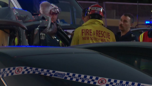 Emergency services discuss how best to deal with the aftermath of the seven-car smash. Picture: Jason Webster/TNV