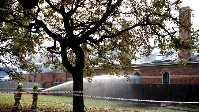 Crews control the blaze. Picture: Andrew Henshaw