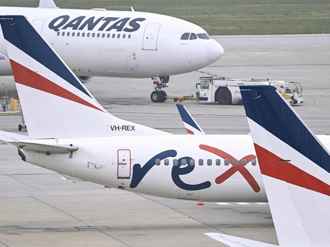 Rex Airlines Boeing 737 planes lay idle on the tarmac in July. Picture: William WEST / AFP