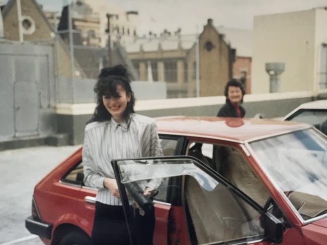 Me with my prized red Ford Laser.