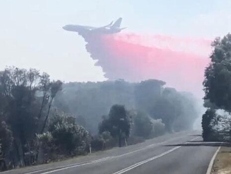 The Larger Air Tanker unloads at Peregian. Picture: Ronnie Stanton