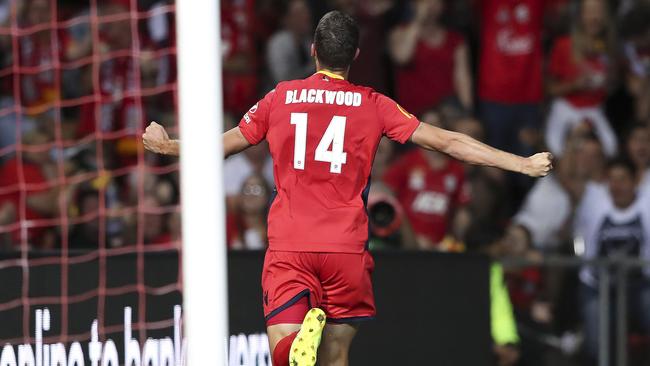 Adelaide United striker George Blackwood celebrates scoring against Melbourne Victory on Friday night. Pictuer: Sarah Reed