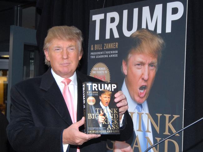 Donald Trump holds a copy of his new book, “Think Big and Kick Ass” at Barnes and Noble on 5th Avenue in New York City on October 16, 2007. Picture: Getty