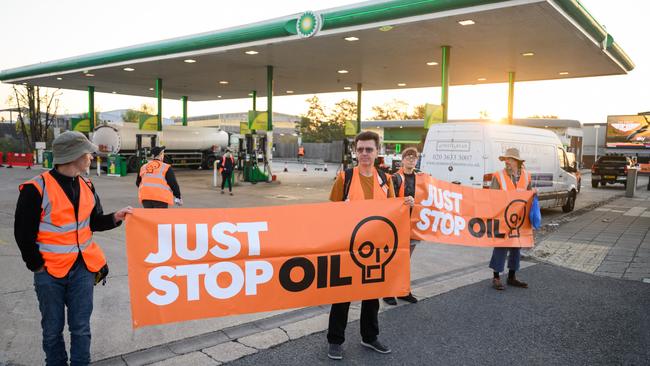 Members of the Just Stop Oil environmental protest group block the entrance and exit of a BP petrol station in London. Picture: Getty Images