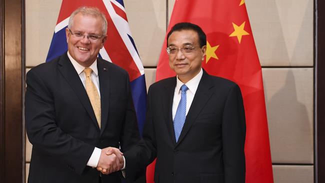 Morrison shakes hands with Premier of the People's Republic of China Li Keqiang. Picture: Lukas Coch