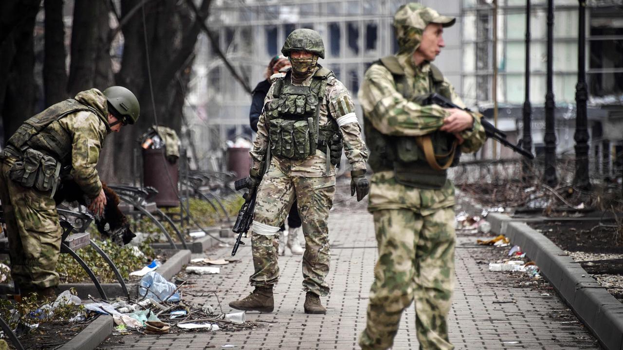 Russian soldiers walks along a street in Mariupol. Picture: Alexander Nemenov/AFP