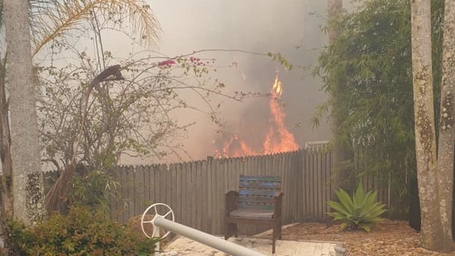 Facebook user Kathryn Jury posted an image showing flames licking at her back fence. Picture: Facebook