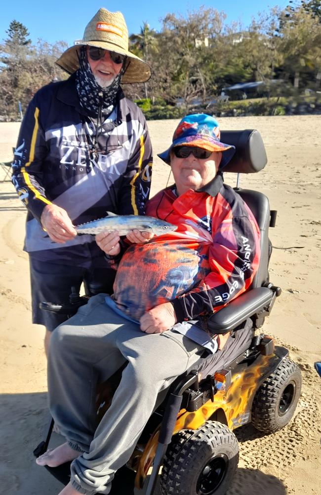 Mackay man Greg Bailey with Victorian visitor Lyle Eliott on Blacks Beach with his first fish in 16 years after his stroke. Photo: Contributed