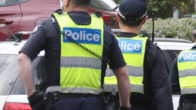 MELBOURNE, AUSTRALIA - NewsWire Photos JULY 05, 2020: Police and medical staff on the scene at Government Housing towers on Racecourse road in Flemington which have been locked down by the Victorian Government in an attempt to stop the outbreak of COVID-19. Picture: David Crosling