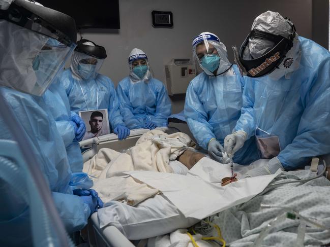 Medical staff members treat a patient suffering with coronavirus disease in Houston, Texas. According to reports, Texas has reached over 916,000 cases, including over 18,000 deaths. Picture: AFP