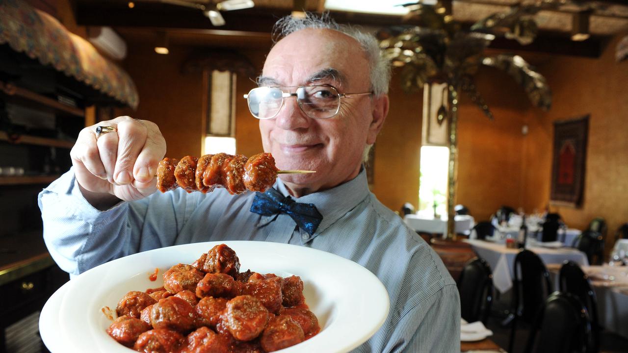 Mr Pouras tucking into his signature dish of meatballs in sauce.