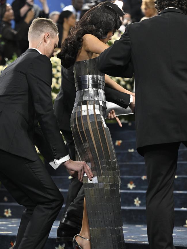 Ortega needed assistance from minders to head up the stairs. Picture: Evan Agostini/Invision/AP
