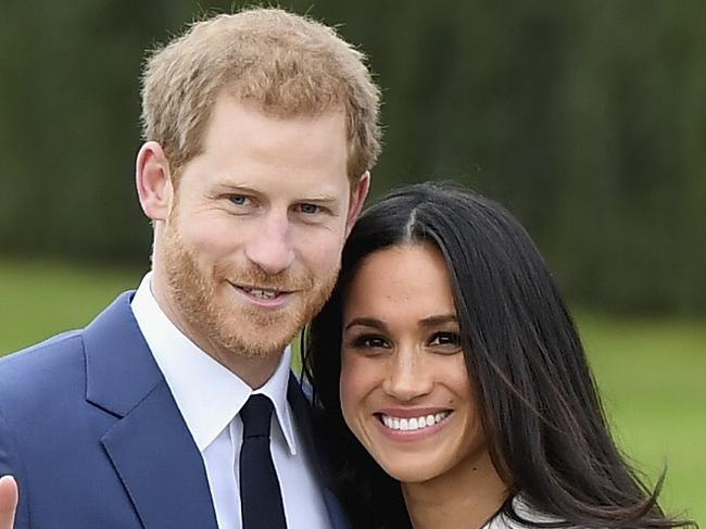 LONDON, ENGLAND - NOVEMBER 27:  Prince Harry (L) and Meghan Markle during an official photocall to announce the engagement of Prince Harry and actress Meghan Markle at The Sunken Gardens at Kensington Palace on November 27, 2017 in London, England.  Prince Harry and Meghan Markle have been a couple officially since November 2016 and are due to marry in Spring 2018.  (Photo by Samir Hussein/Samir Hussein/WireImage)
