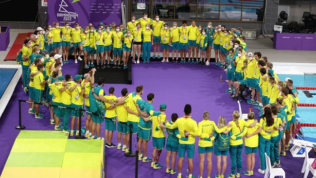 The swim team pulls together for their war cry. Picture: Michael Klein