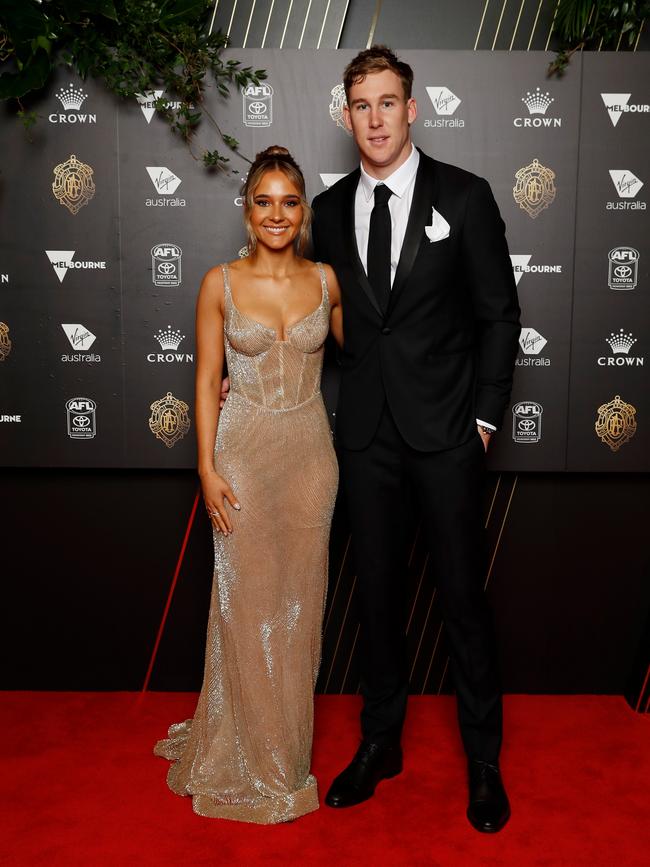 The stunning Olivia Burke and Tom Lynch pose up a storm on the Brownlow red carpet. Picture: Dylan Burns