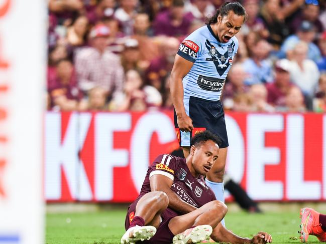 Blues five-eighth Jarome Luai stands over Maroons forward Felise Kaufusi in Game 1.