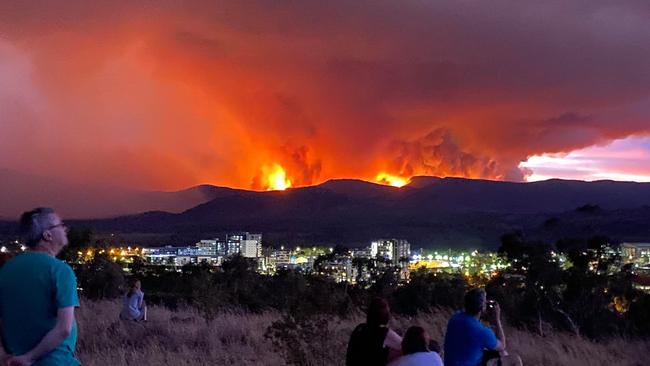 A fire rages south of Canberra as residents watch on. Picture: Josh Cox