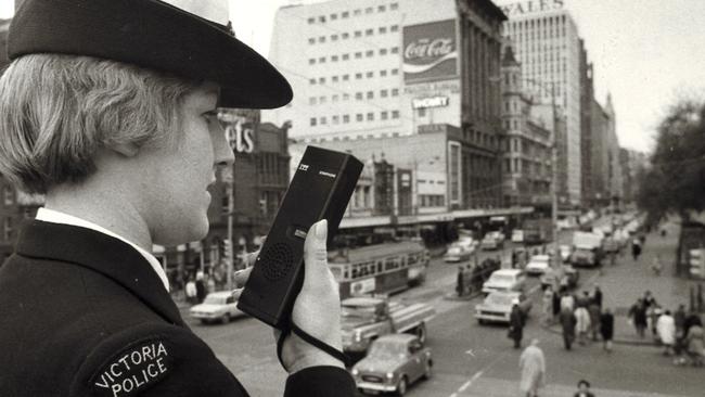 September 1971: Constable Gail Beams, 21, tests a new police pocket radio at Princes Bridge railway station. Picture: Herald Sun